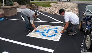 painting parking lot lines with a roller