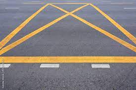 diagonal yellow stripes on road