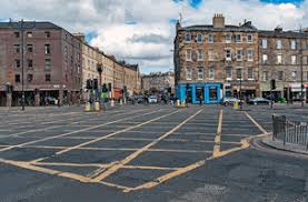 yellow cross line on road