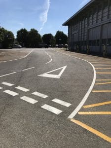 white zigzag lines on road